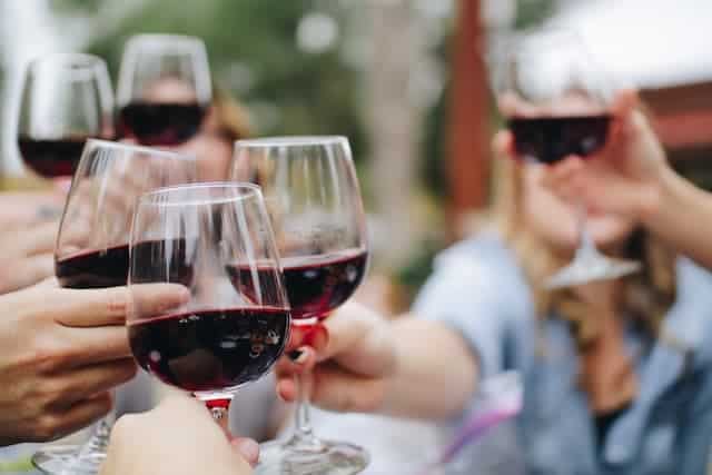 cheersing with wine