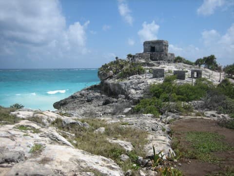 View of Tulum ruins and ocean from a distance