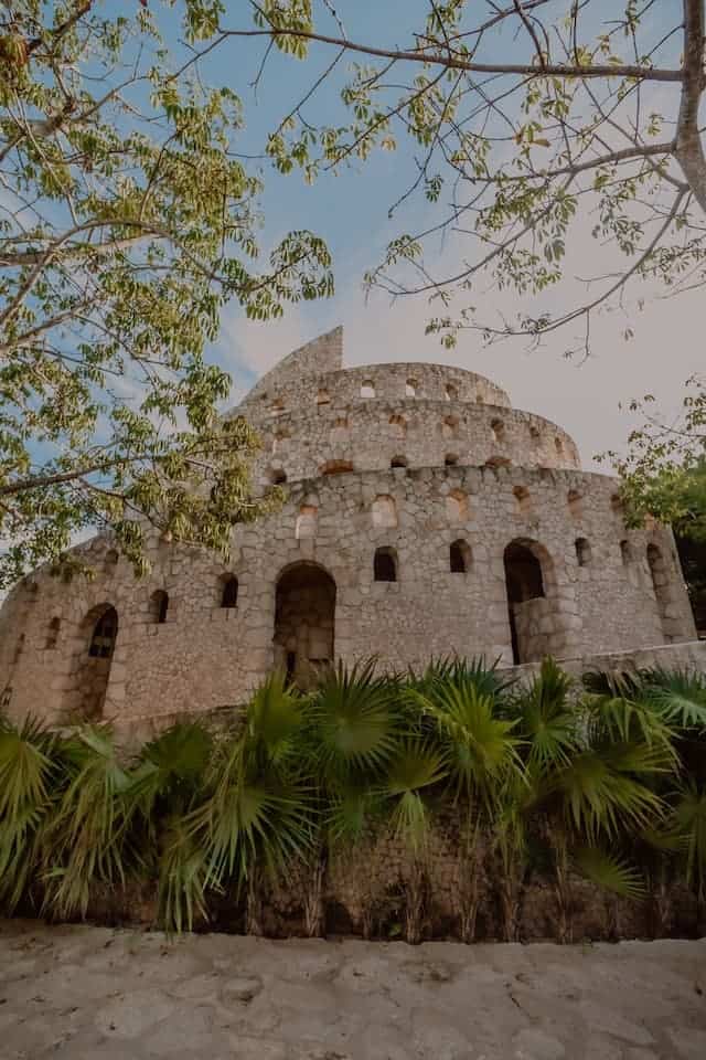 view of brown concrete building in Tulum . Xcaret Park