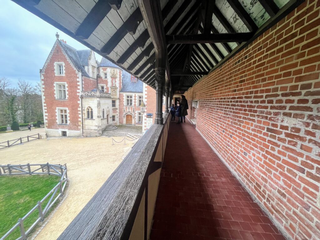 Open-air corridor in Chateau Clos Luce on a clear day, a stop worth adding to your Loire Valley itinerary