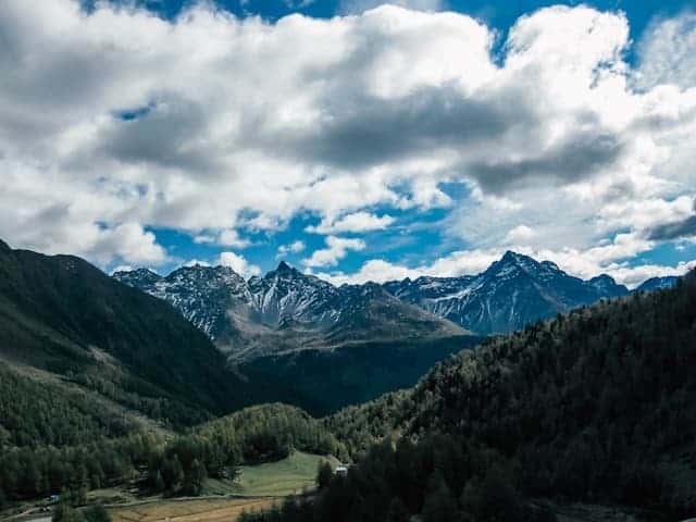 view of mountains in Italy with dense clouds overhead