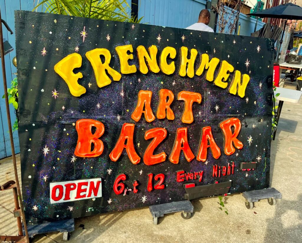 sign saying Frenchmen Art bazaar,  in new orleans