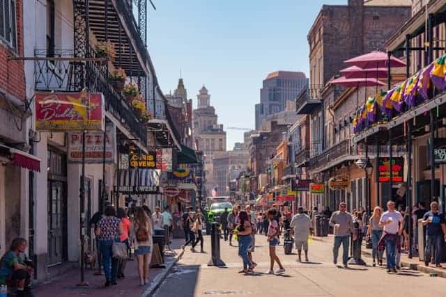 A view of bustling and colorful Bourbon street can be seen when visiting New Orleans in winter or year-round
