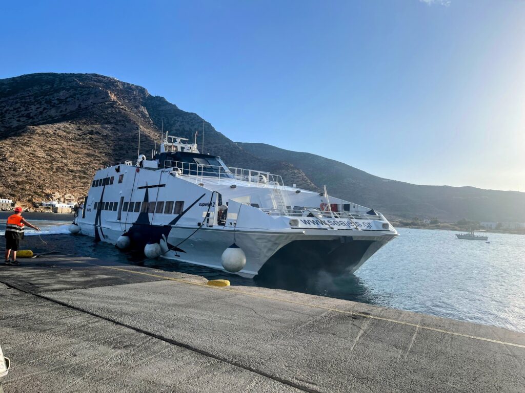 ferry at port with mountain in the background