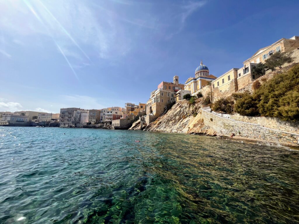 Add Syros to your Greek islands itinerary. View of Venetian church above the ocean