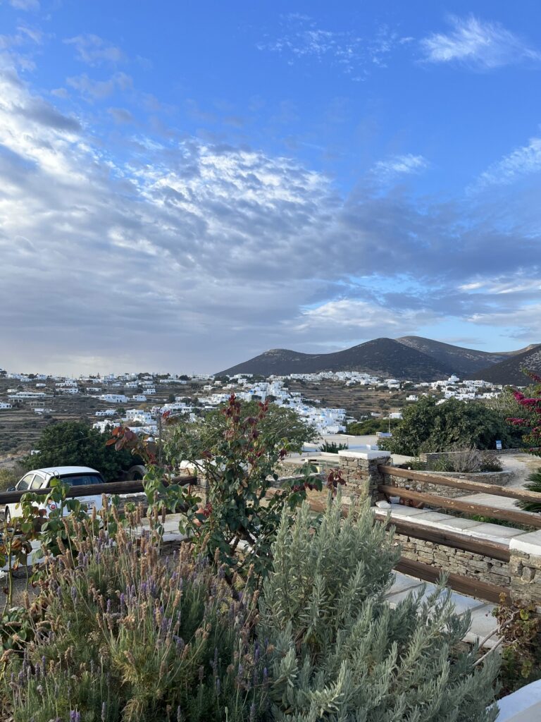 view from up high over mountain town on a clear day with blue skies